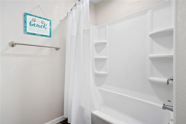 219 Pintail Ln, Rockport, TX 78382 - full bathroom with shower / bath combo with shower curtain