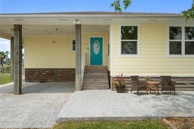 219 Pintail Ln, Rockport, TX 78382 - view of exterior entry featuring a patio