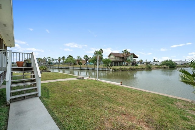 219 Pintail Ln, Rockport, TX 78382 - view of grassy yard featuring stairs and a water view