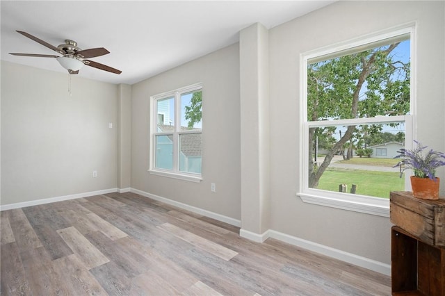 219 Pintail Ln, Rockport, TX 78382 - unfurnished room featuring light wood finished floors, ceiling fan, and baseboards