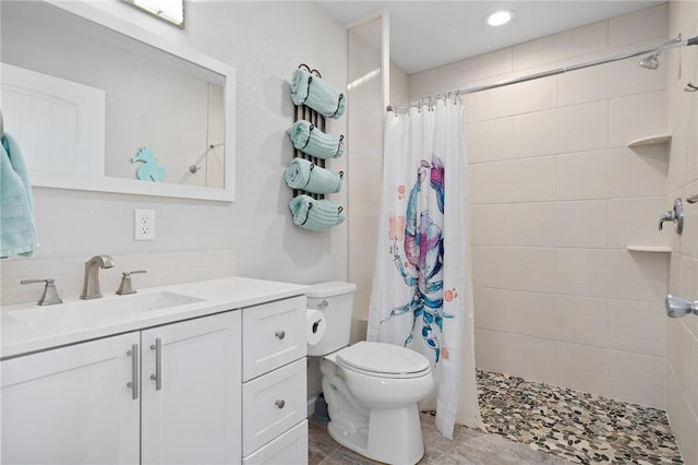 219 Pintail Ln, Rockport, TX 78382 - bathroom with toilet, vanity, a tile shower, and recessed lighting