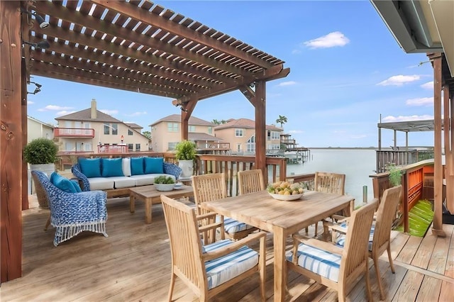 wooden deck featuring an outdoor living space, a water view, outdoor dining space, and a pergola