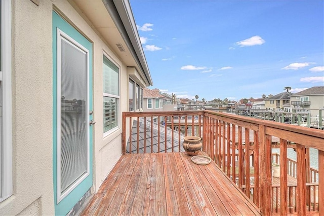 wooden deck with a residential view