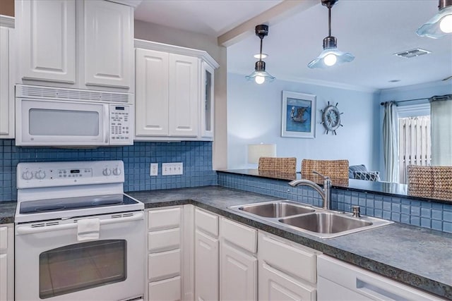 kitchen featuring white appliances, a sink, visible vents, white cabinets, and dark countertops