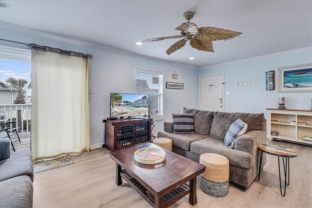 living room featuring recessed lighting, a ceiling fan, baseboards, light wood finished floors, and crown molding