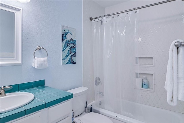 bathroom with toilet, shower / bathtub combination with curtain, and vanity