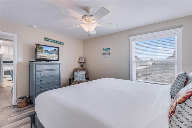 bedroom with ceiling fan and wood finished floors