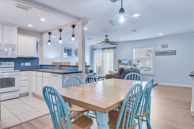 dining room featuring recessed lighting, visible vents, baseboards, a ceiling fan, and light wood-type flooring