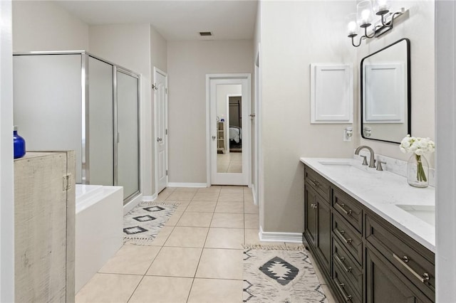 6105 Greenough Ct, Corpus Christi, TX 78414 - bathroom featuring double vanity, a shower stall, tile patterned floors, and a bath