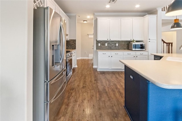 6105 Greenough Ct, Corpus Christi, TX 78414 - kitchen featuring appliances with stainless steel finishes, tasteful backsplash, white cabinets, and recessed lighting