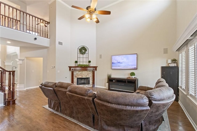 6105 Greenough Ct, Corpus Christi, TX 78414 - living area with wood finished floors, a stone fireplace, stairs, a towering ceiling, and a ceiling fan