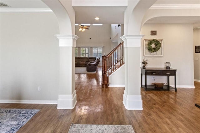 6105 Greenough Ct, Corpus Christi, TX 78414 - entrance foyer with a ceiling fan, arched walkways, ornate columns, wood finished floors, and crown molding