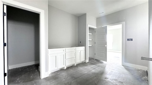 bathroom with concrete flooring