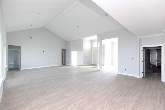 unfurnished living room featuring light hardwood / wood-style flooring, beamed ceiling, and high vaulted ceiling