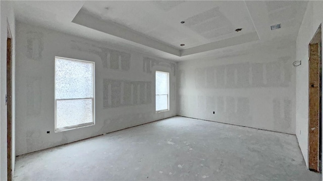 empty room with a raised ceiling