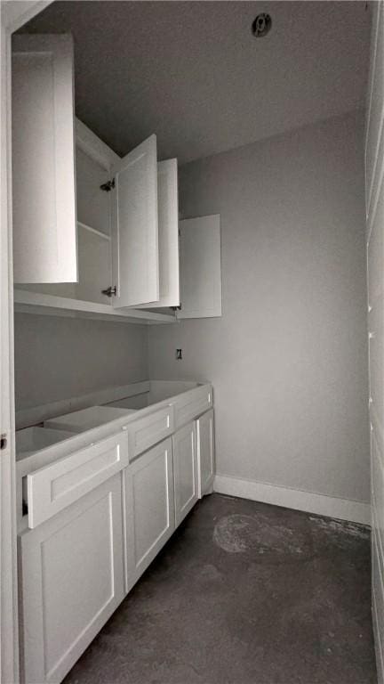 bathroom featuring concrete flooring and vanity