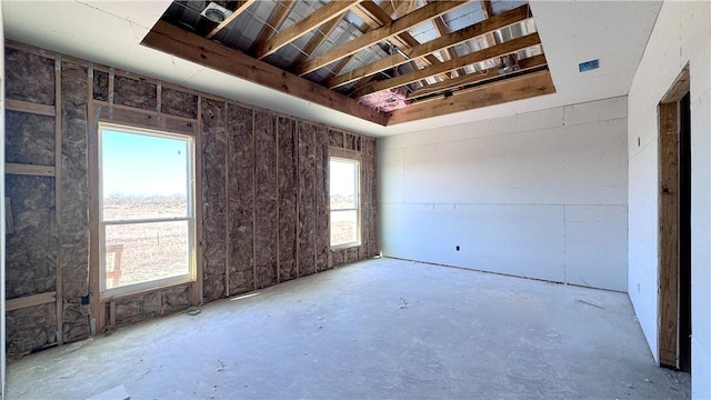 empty room with concrete flooring