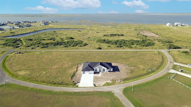 birds eye view of property featuring a rural view and a water view