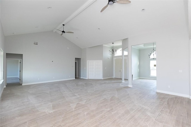 unfurnished living room featuring beam ceiling, ceiling fan with notable chandelier, light hardwood / wood-style floors, and high vaulted ceiling