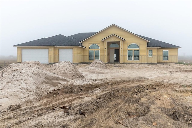 view of front of property with a garage