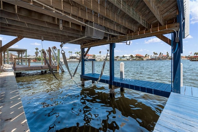 view of dock with a water view and boat lift