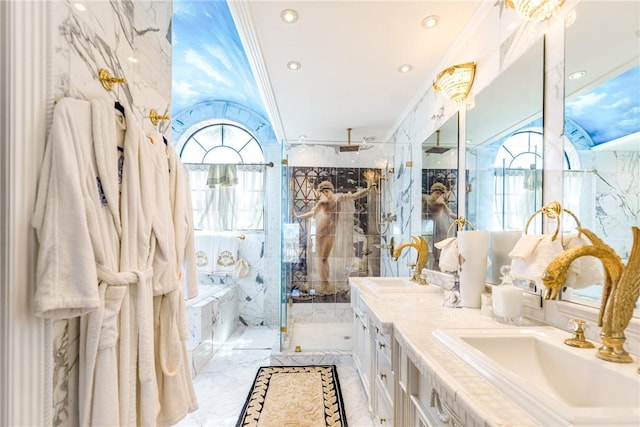 bathroom featuring double vanity, a shower stall, marble finish floor, and a sink