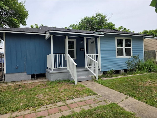 1540 Daytona Dr, Corpus Christi, TX 78415 - view of front of home with a front lawn and roof with shingles