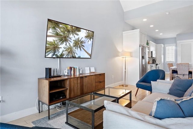 living room featuring recessed lighting and baseboards