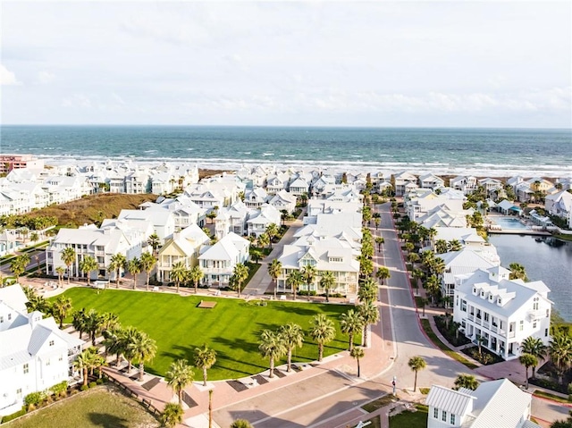 drone / aerial view with a residential view and a water view