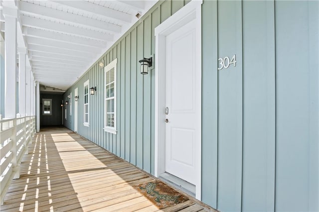 doorway to property featuring board and batten siding