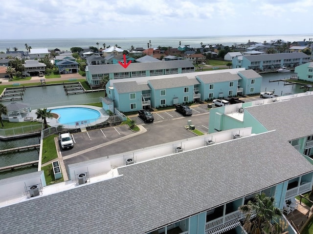 birds eye view of property with a water view