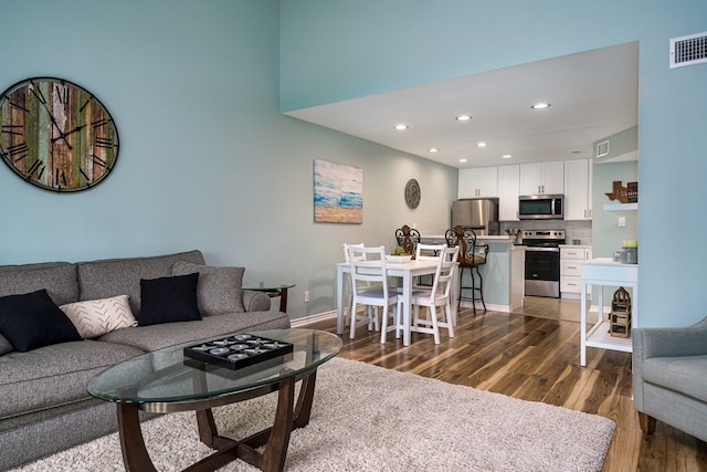 living room with dark hardwood / wood-style floors