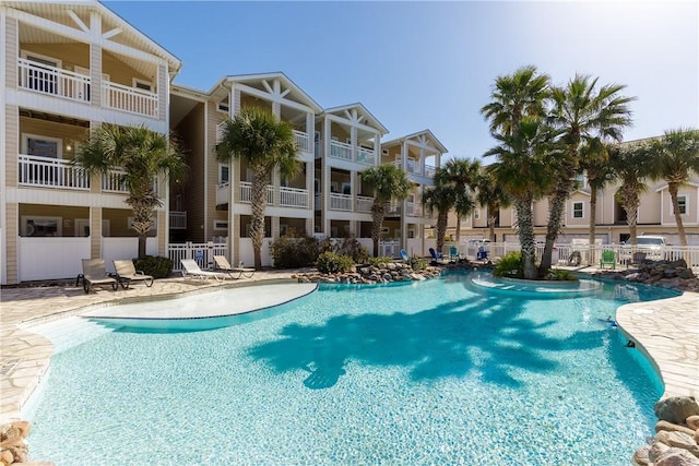 14202 Encantada Ave Unit 603, Corpus Christi, TX 78418 - community pool with a patio area and fence