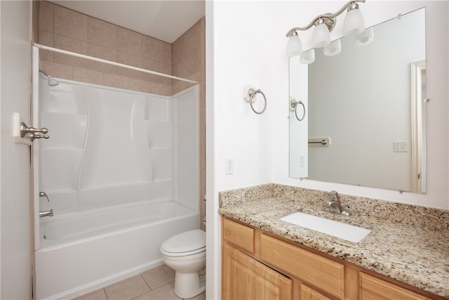 full bathroom featuring toilet, vanity, tile patterned floors, and shower / washtub combination