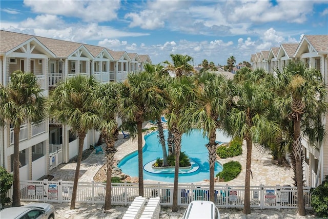 14202 Encantada Ave Unit 603, Corpus Christi, TX 78418 - view of swimming pool featuring fence and a residential view