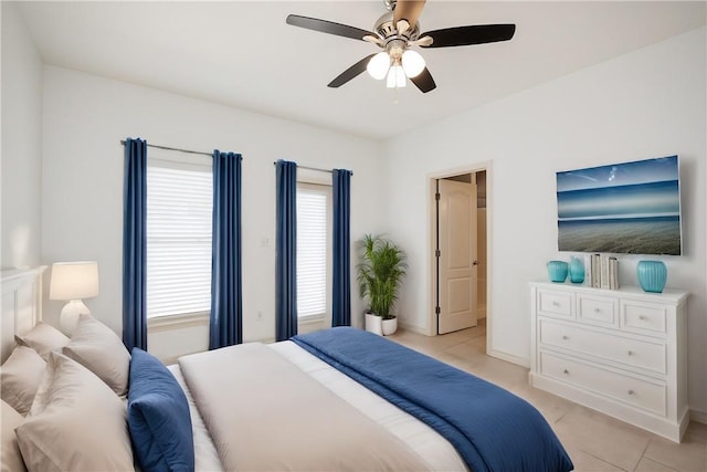 14202 Encantada Ave Unit 603, Corpus Christi, TX 78418 - bedroom with light tile patterned flooring, multiple windows, and a ceiling fan