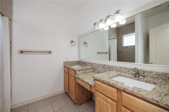 bathroom featuring a shower with curtain, vanity, and tile patterned floors