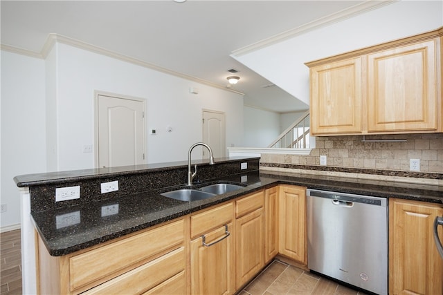 kitchen featuring ornamental molding, dark stone counters, light brown cabinetry, sink, and dishwasher