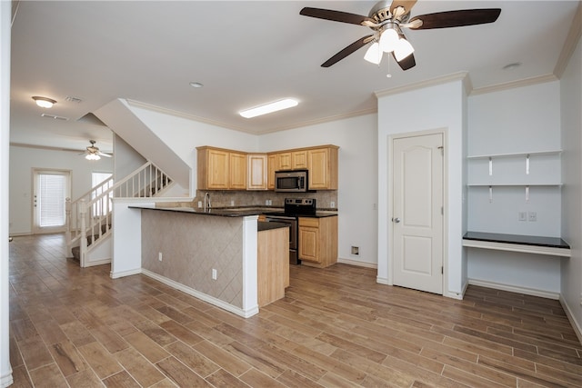 kitchen featuring kitchen peninsula, appliances with stainless steel finishes, hardwood / wood-style flooring, and light brown cabinetry