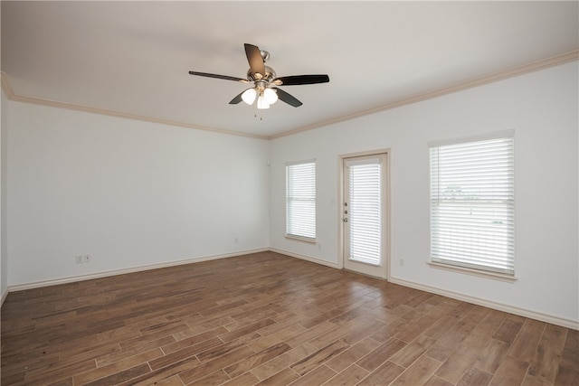 empty room featuring hardwood / wood-style floors, ceiling fan, plenty of natural light, and ornamental molding