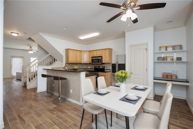 dining room with dark wood-type flooring, ceiling fan, and crown molding