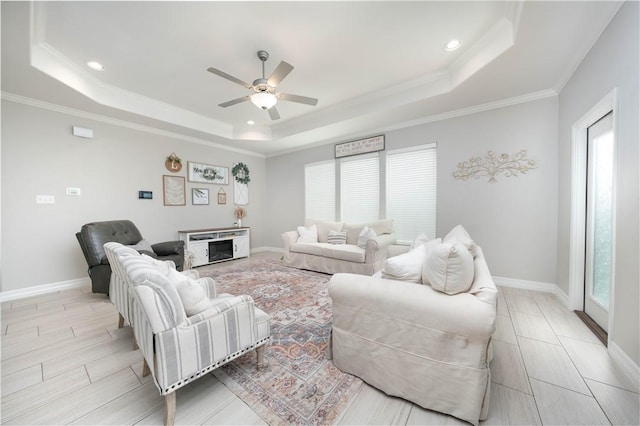 3141 Piranha Dr, Corpus Christi, TX 78414 - living room with a raised ceiling, healthy amount of natural light, a ceiling fan, recessed lighting, and crown molding