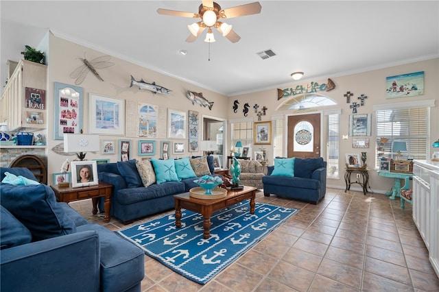 living room featuring ornamental molding, tile patterned flooring, and ceiling fan