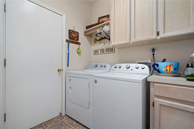 laundry room with cabinets and washer and clothes dryer