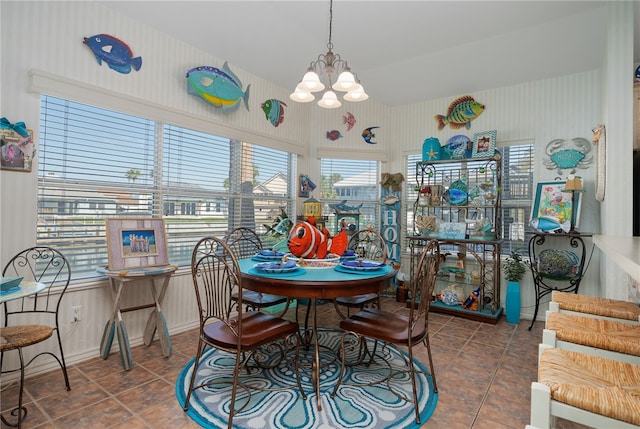 tiled dining space with an inviting chandelier