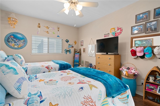 bedroom featuring dark hardwood / wood-style flooring and ceiling fan