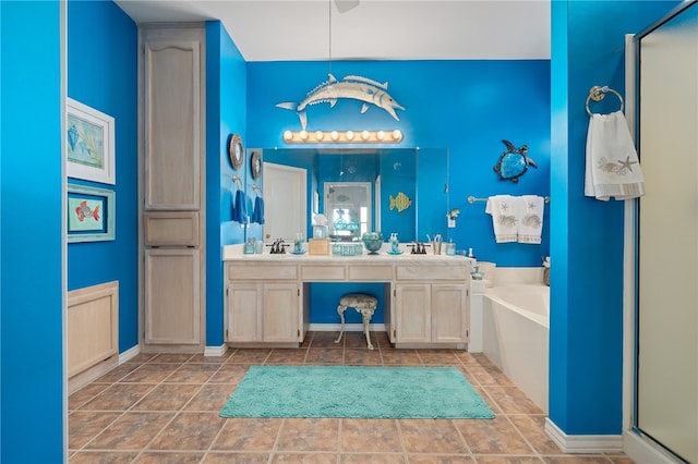 bathroom featuring tile patterned flooring, vanity, and separate shower and tub