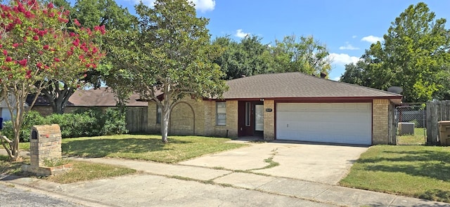 view of front facade with a garage and a front yard