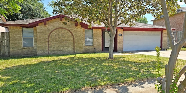 ranch-style home with a garage and a front yard