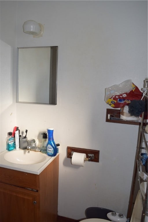 bathroom featuring vanity and toilet